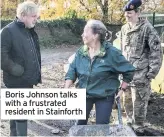  ??  ?? Boris Johnson talks with a frustrated resident in Stainforth