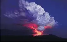  ?? Reuters ?? Force of nature The Wolf volcano spews smoke and lava on Isabela Island. The volcano perched atop one of Ecuador’s Galapagos Islands erupted in the early hours of Monday.