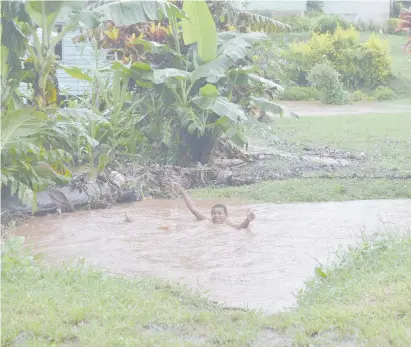  ?? Photo: Shratika Naidu. ?? Fiji Sun saw this boy playing in a flooded drain near Labasa yesterday.