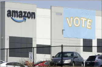  ?? JAY REEVES – THE ASSOCIATED PRESS ?? Amazon workers across the country face fewer hurdles under a new agreement that requires Amazon to inform past and current workers of their rights and ensures that it can’t interfere with labor organizing on company property after hours.