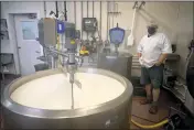  ?? ?? Dairy farmer Jarred Boyce pumps fresh milk into vats. By 5 p.m., the morning milk batch is ready to start aging into fine cheese. Jarred and his wife Trisha Boyce milk around 40 cows twice a day on their farm.