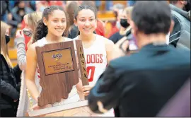  ??  ?? Sisters Alyna and Alyvia Santiago pose for a photo with the Class 4A LaPorte Semistate plaque after the game.