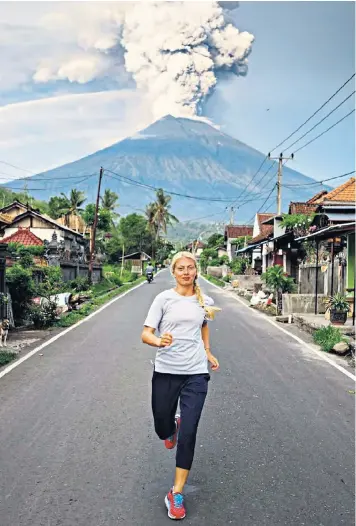  ??  ?? Russian runner Anna Kosova received approval for her photo, but a Ukrainian Instagram user received ire for her posts of Bali’s volcano