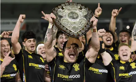  ?? PHOTO: GETTY IMAGES ?? Shield be right . . . Wellington captain Du’Plessis Kirifi celebrates with the Ranfurly Shield at McLean Park on Saturday night.