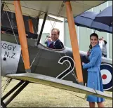  ??  ?? Up, up and away: Prince William and Kate Middleton admire a biplane