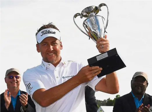  ?? — AFP ?? All smiles: Ian Poulter posing with the trophy after winning the Houston Open at the Golf Club of Houston in Humble, Texas, on Sunday.