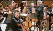  ?? CONTRIBUTE­D BY JEFF ROFFMAN ?? ASO music director Robert Spano conducts the Atlanta Symphony Orchestra and guest artist Johannes Moser at Symphony Hall.