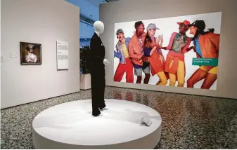  ?? Karen Warren / Staff photograph­er ?? The show’s “Remix” gallery features an image from Oliviero Toscani ’s ad series for Benetton, which broke ground by showing diverse models together. The company eventually fired Toscani for work it deemed too political but rehired him in 2017.