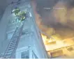  ??  ?? A VIDEO shows firemen climbing ladders to the top floors of the burning block of flats in Paris yesterday. | AP