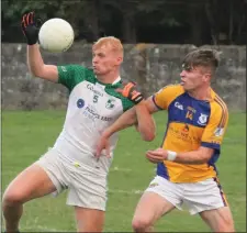  ??  ?? Darragh Lyons of St. James’ battling it out with Ian Carty.