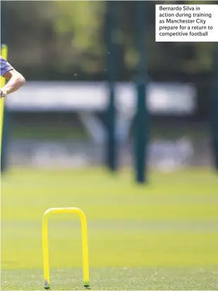  ??  ?? Bernardo Silva in action during training as Manchester City prepare for a return to competitiv­e football