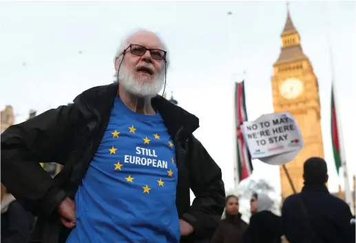  ??  ?? NOT FOR much longer. A man protests against Brexit in London.