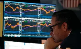  ?? Photograph: Timothy A Clary/AFP/Getty Images ?? Traders work on the floor during the opening bell of the New York Stock Exchange on 16 May.