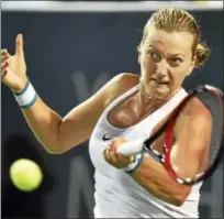 ?? CATHERINE AVALONE — REGISTER ?? Petra Kvitova returns a shot against Agnieszka Radwanska.