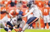  ?? DAVID ZALUBOWSKI/ASSOCIATED PRESS ?? Chicago kicker Eddy Pineiro steps into a 53-yard attempt that sailed between the goal posts at the final gun, giving the Bears a 16-14 win over Denver.