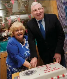  ??  ?? Maureen Carroll and Brian Devaney cutting the 40th Anniversar­y cake. Pics: James Connolly