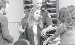  ?? LANNIS WATERS/AP ?? Dalia Dippolito reaches out as she is taken into custody after being found guilty in her third attempted murder trial on June 16, 2017, in West Palm Beach.