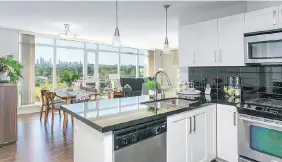  ??  ?? This two-bedroom condo at 508 — 2133 Douglas Rd. in Burnaby came with a well-equipped kitchen. It was on the market for less than a week and sold for $730,000.