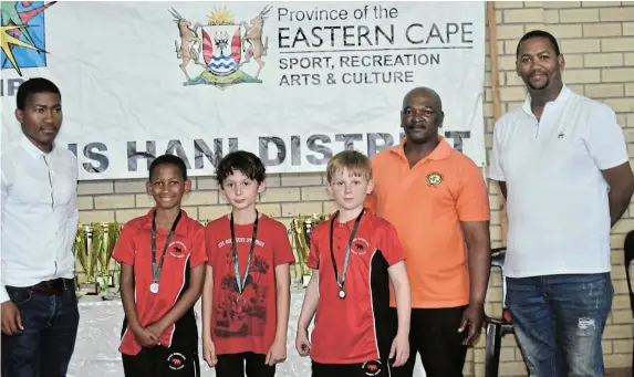  ?? Picture: ABONGILE SOLUNDWANA ?? CHESS CHAMPS: Nelson Mandela Bay U10 chess players received medals at the provincial chess tournament at the Thobi Kula Indoor Sports Centre, in Komani on Sunday. Pictured here are, from left, Eastern Cape interim deputy president Luxolo Valanti, Nelson Mandela Bay Chess players Jaden Chipunza – Silver, Zac Oved – Gold and Charlie Manton – Bronze, Madoda Mapeyi and EC Chess interim president Luzuko Ndinise