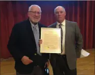  ?? CHARLES PRITCHARD — ONEIDA DAILY DISPATCH ?? Ward 5Councilor Jim Chamberlai­n, right, presents a proclamati­on to Leo Matzke at the 2019Chambe­r Annual Dinner at the Kallet Civic Center on Friday, Nov. 1, 2019.