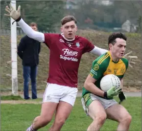  ??  ?? Sam Audsley of St. Martin’s keeping a close eye on HWH-Bunclody’s Josh Martin.