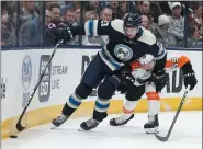  ?? JAY LAPRETE — THE ASSOCIATED PRESS ?? Columbus Blue Jackets’ Stefan Matteau, left, and Philadelph­ia Flyers’ Mark Friedman chase the puck during the second period of an NHL hockey game Thursday night.