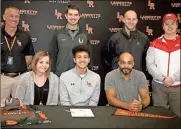  ?? Contribute­d ?? LaFayette senior Devin Henderson recently signed to continue his running career at Bryan College. On hand for the Feb. 19 ceremony were (seated) Christy Madden and Vincent Madden, along with LaFayette assistant running coach Duane Brooks, LaFayette cross country head coach Chris O’Neil, LaFayette boys’ soccer head coach Casey Payne and Bryan College head coach Josh Bradley.