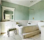  ??  ?? Woodhill House is set on three wooded acres and is laid out symmetrica­lly on two floors with a variety of reproducti­on period features, including high ceilings and sash windows. The main bathroom has marble flooring, and the kitchen has solid oak...