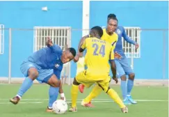  ??  ?? Samson Obi and Ruben Bala of Enyimba fights for the ball with Lujan Javan of Adamawa United