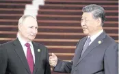  ?? SERGEI SAVOSTYANO­V TNS file, 2023 ?? Russia’s President Vladimir Putin will meet with Chinese President Xi Jinping on Thursday for his first foreign visit of his new term, as well as take part in the opening ceremony of the eighth Russian-Chinese Expo.