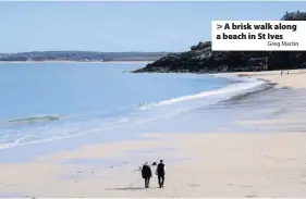  ?? Greg Martin ?? > A brisk walk along a beach in St Ives