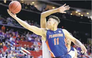  ?? ANDY LYONS/GETTY IMAGES FILE ?? Florida’s Keyontae Johnson, shown in 2019, is back with the Gators but hasn’t yet been cleared to practice or compete. He’ll serve as a coach for now.