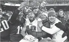  ?? BRAD MILLS/USA TODAY SPORTS ?? Wide receiver Golden Tate (19) celebrates with Eagles fans after Philadelph­ia clinched the last NFC wild-card slot with the 24-0 road win against the Redskins.