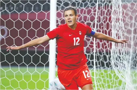  ?? KIM HONG-JI/REUTERS ?? Christine Sinclair celebrates scoring Team Canada's first — and only — goal against Japan, after tapping in her own rebound.