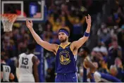  ?? JOSE CARLOS FAJARDO — BAY AREA NEWS GROUP ?? The Warriors' Klay Thompson (11) gestures to the audience in the fourth quarter of Game 6of a second-round playoff series at Chase Center in San Francisco on Friday.