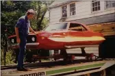  ?? COURTESY ?? Scott Wegener with the flying Chevy Camaro made by a high school auto shop class for his movie “The Spider’s Web” in 1995. “The Spider’s Web,” along with the two other films in the trilogy will be shown at the Woodland Opera House on Sunday, June 20, 2021.