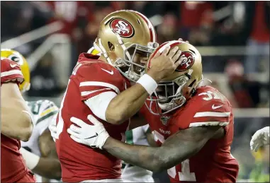  ?? MARCIO JOSE SANCHEZ — THE ASSOCIATED PRESS ?? 49ers running back Raheem Mostert, right, celebrates his touchdown with quarterbac­k Jimmy Garoppolo during the second half Jan. 19 in Santa Clara, Calif.