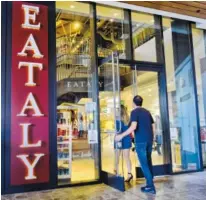  ?? AP PHOTO/RICHARD VOGEL ?? Customers arrive at Eataly at the Westfield Century City Mall in the Century City section of Los Angeles. Many mall owners are spending billions to add more upscale restaurant­s and bars, premium movie theaters, bowling alleys and similar amenities.