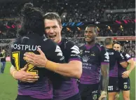  ?? GETTY IMAGES ?? Tohu Harris, left, and Griffin celebrate winning the 2017 NRL preliminar­y final with the Melbourne Storm. Now they’re with the Warriors as captain and forwards coach, respective­ly.