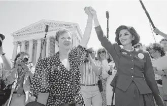  ?? J. Scott Applewhite / Associated Press file ?? Norma McCorvey, center, and her attorney Gloria Allred leave the Supreme Court on April 26, 1989, after sitting in while the court listened to arguments in a Missouri abortion case.