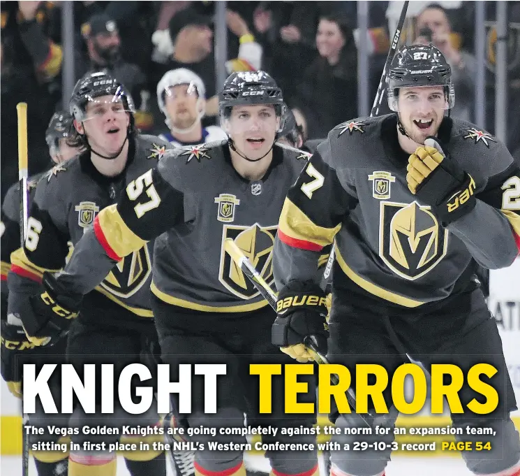  ?? — GETTY IMAGES FILES ?? The Vegas Golden Knights celebrate after scoring against the Tampa Bay Lightning in the dying seconds of their game on Dec. 19.