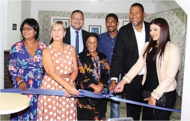  ??  ?? MEC for Cultural Affairs and Sport, Anroux Marais, chief Mandla Mandela and his wife, Nosekeni Rabia Mandela, officially open the photo exhibition in the kitchen of the Nelson Mandela House at Drakenstei­n Correction­al Centre in Paarl.