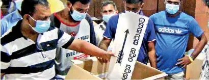  ?? Pic by Hiran Priyankara ?? Election Commission officials and staff making arrangment­s to hold Sri Lanka's 16th general elections on August 5.