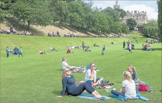  ??  ?? SUN-SEEKERS: People enjoy the warm weather in Edinburgh’s Princes Street Gardens yesterday, as forecaster­s predict flash floods and thundersto­rms will hit Scotland today.