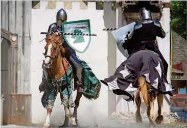  ?? STEVE SCHAEFER PHOTOS / SPECIAL TO THE AJC ?? Horseback riders compete during the jousting demonstrat­ion during the Georgia Renaissanc­e Festival in Fairburn.