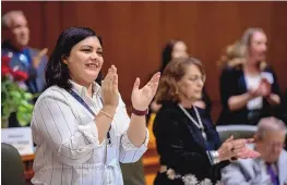  ?? EDDIE MOORE/JOURNAL ?? Rep. Yanira Gurrola, D-Albuquerqu­e, applauds during a joint session of the House and Senate on Feb. 13. The former middle school math teacher was appointed to the House just days before the start of this year’s 60-day legislativ­e session.