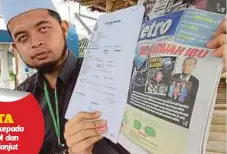  ??  ?? AFIQ Luqman menunjukka­n keratan akhbar dan salinan laporan polis yang dibuat. Gambar fail - 11 Jun 2018.