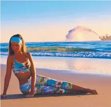  ?? Picture: @pilatesbyl­isa ?? Lisa Pentony relaxes on a Gold Coast beach.