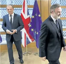  ?? YVES HERMAN/ASSOCIATED PRESS ?? Britain’s permanent representa­tive to the European Union Tim Barrow, right, leaves after he delivered British Prime Minister Theresa May’s Brexit letter in notice of the U.K.’s intention to leave the bloc under Article 50 of the EU’s Lisbon Treaty to...