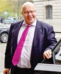  ??  ?? Altmaier arrives for further explorator­y talks with members of potential coalition parties to form a new government in Berlin. — AFP photo